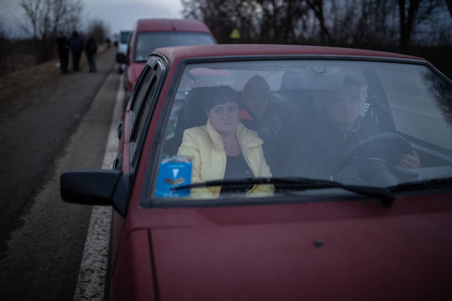Ludmilla waits in her car with her family in a traffic jam backed up towards the border crossing into Poland. Oliver Marsden for The National