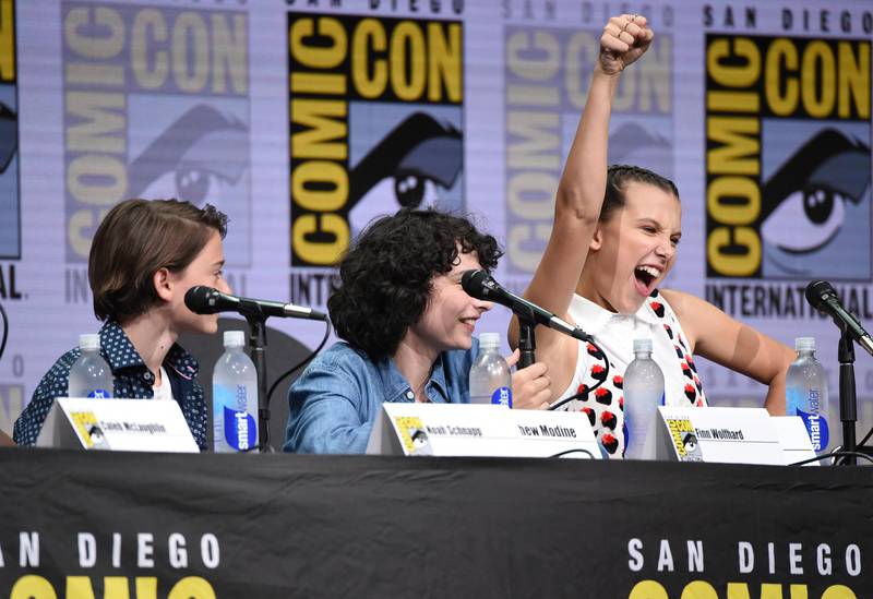 Millie Bobby Brown, right, gestures as from left, Noah Schnapp, and Finn Wolf look on at the "Stranger Things" panel on day three of Comic-Con International on Saturday, July 22, 2017, in San Diego. (Photo by Richard Shotwell/Invision/AP)
