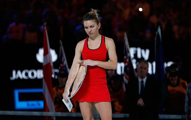 MELBOURNE, AUSTRALIA - JANUARY 27:  A dejected Simona Halep of Romania looks on after losing the women's singles final to Caroline Wozniacki of Denmark on day 13 of the 2018 Australian Open at Melbourne Park on January 27, 2018 in Melbourne, Australia. (Photo by Scott Barbour/Getty Images)