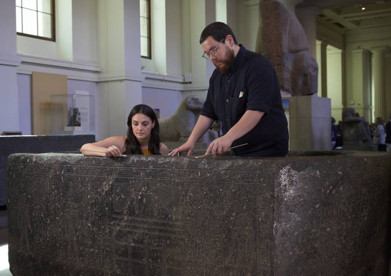 Ms Vasiliou and conservation student Shoun Obana clean ‘The Enchanted Basin’. The reused ritual bath was discovered near a mosque in Cairo. Photo: The Trustees of the British Museum