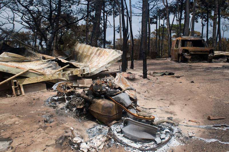 A burned out vehicle and remains of the Blue Waves campsite in Gironde, France. Bloomberg 