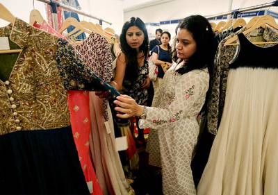 Brides-to-be browse the extravagant dress designs at the Big Fat Indian Wedding Expo in Dubai. Flyrobe’s business largely depended on weddings and many of these were postponed in 2020 and the first half of 2021. Satish Kumar / The National