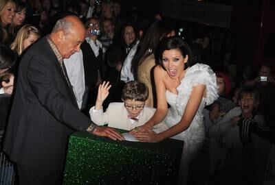 Mohamed Al Fayed and pop star Dannii Minogue switch on the Harrods Christmas lights in 2009.