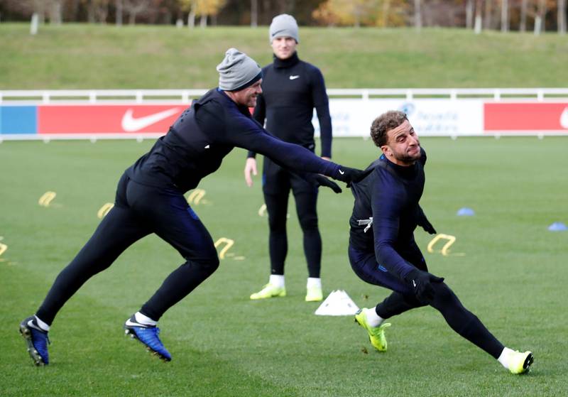 Wayne Rooney and Kyle Walker share a laugh during training. Reuters