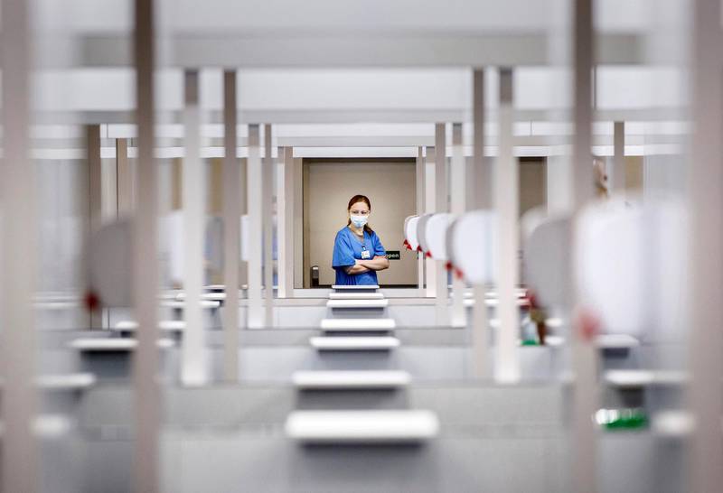An NHS employee looks over the vaccination bays at the Elland Road mass vaccination centre in Leeds. AP Photo