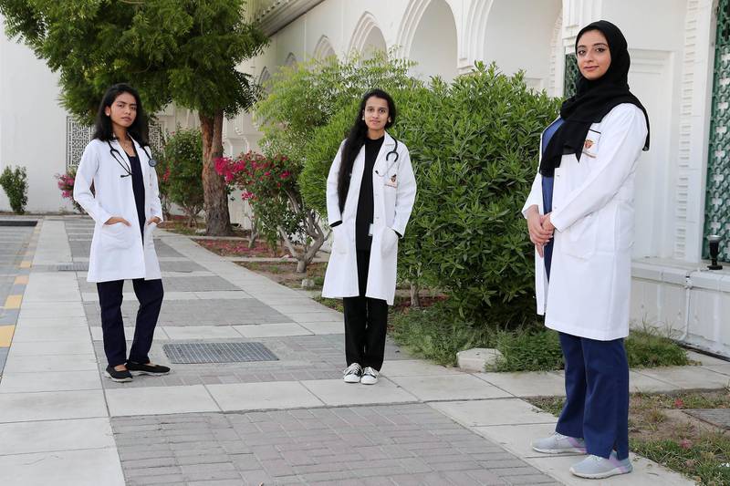 AJMAN, UNITED ARAB EMIRATES , June 17  – 2020 :- Left to Right -  Priya Rani, Krishnaveni and Salwa Ali Ghanem , students of Gulf Medical University Ajman outside the Thumbay hospital in Ajman. These medical students volunteered at local hospitals when Covid hit in the UAE.  (Pawan Singh / The National) For News. Story by Anna