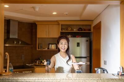 Jin Soo-young serves up coffee in the kitchen.