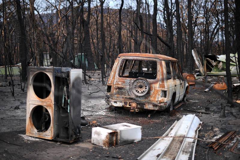 A burnt vehicle is seen following bushfires in Budgong National Park. AFP