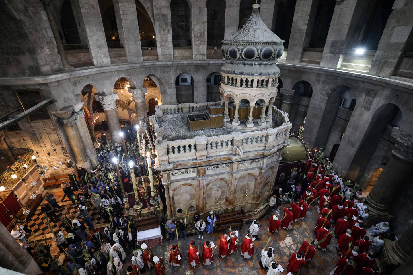 Roman Catholic clergy carry palm branches during a Palm Sunday procession at the Church of the Holy Sepulchre in Jerusalem's Old City. AFP