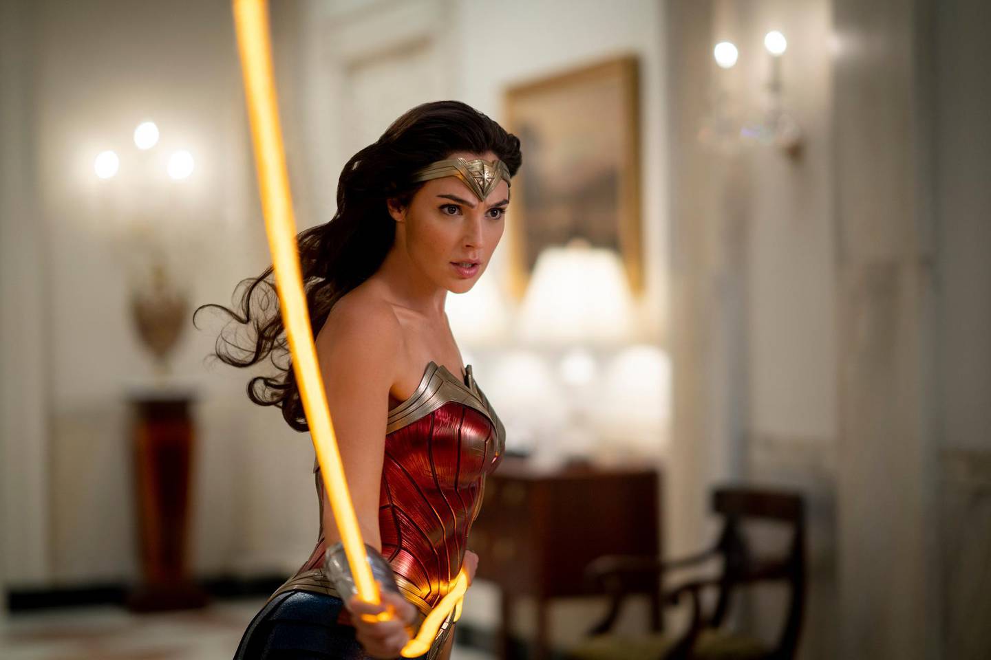 This image released by Warner Bros. Entertainment shows Gal Gadot in a scene from "Wonder Woman 1984." The superhero sequel earned an estimated $38.5 million in ticket sales from international theaters, Warner Bros. said Sunday, Dec. 20, 2020.   (Clay Enos/Warner Bros. via AP)