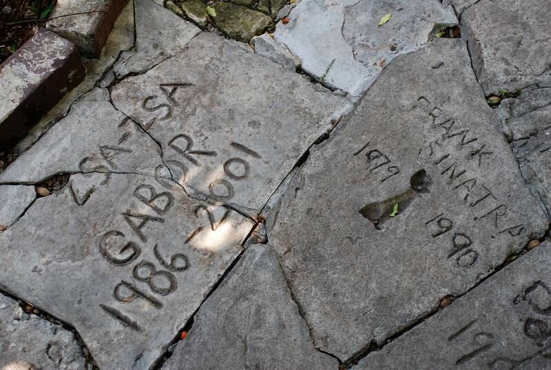 Monuments to the six-toed cats that once called the Key West house their home. Photo: Adam Fagen