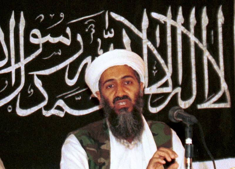 FILE - In this 1998 file photo made available on March 19, 2004, Osama bin Laden is seen at a news conference in Khost, Afghanistan. Never-before seen video of Osama bin Ladenâ€™s son and potential successor was released Nov. 1, 2017, by the CIA in a trove of material recovered during the May 2011 raid that killed the al-Qaida leader at his compound in Pakistan. The video offers the first public look at Hamza bin Laden as an adult. Until now, the public has only seen childhood pictures of him. In recent years, al-Qaida has released audio messages from Hamza bin Laden. (AP Photo/Mazhar Ali Khan, File)