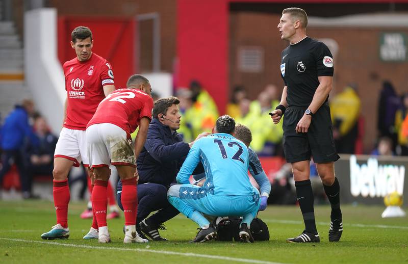 Nottingham Forest goalkeeper Keylor Navas receives medical attention. PA