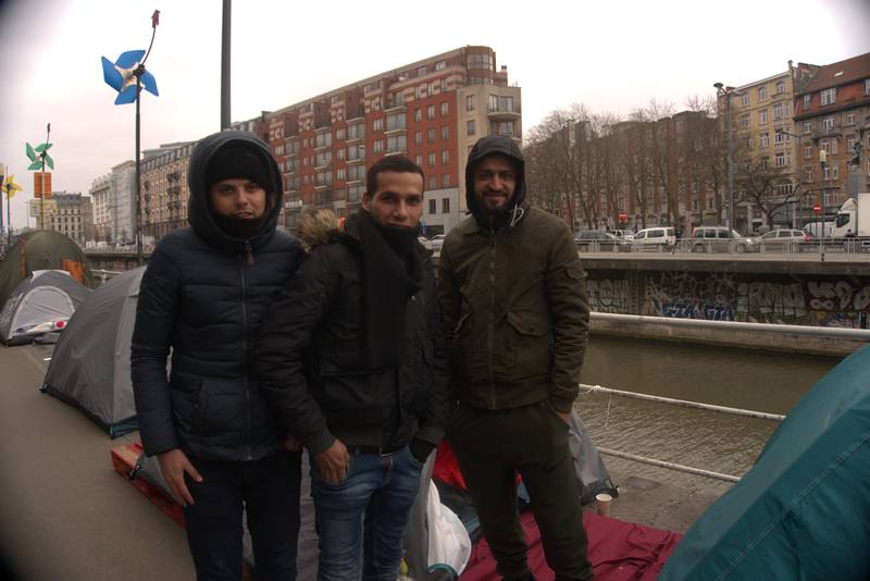 Abdelrahman (far right) and two other Palestinian asylum seekers near Le Petit Chateau reception centre in Brussels. Sunniva Rose / The National