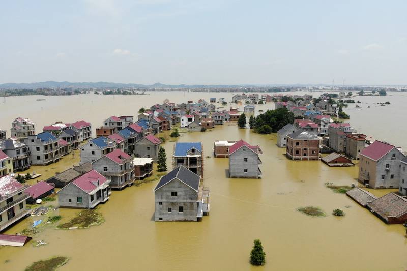 Buildings and farmlands are seen partially submerged in floodwaters following heavy rainfall in the Jiangxi province of China in 2020, which led to renewed calls for the country to transform more areas into sponge cities. Photo: Reuters