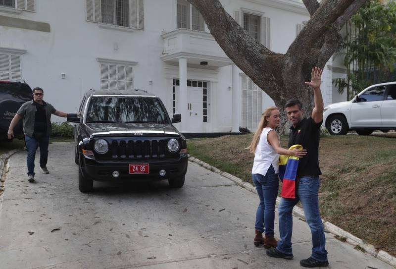 Leopoldo Lopez and his wife Lilian Tintori outside the Spanish ambassador's residence in Caracas, where they have taken refuge after a failed uprising launched on April 30, 2019.  EPA