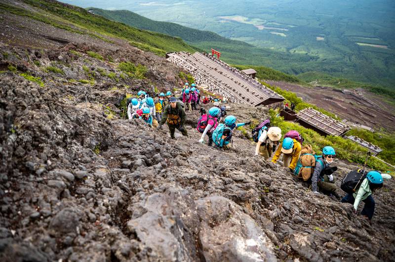 Hikers climb the steep slope of Mount Fuji in Japan. AFP