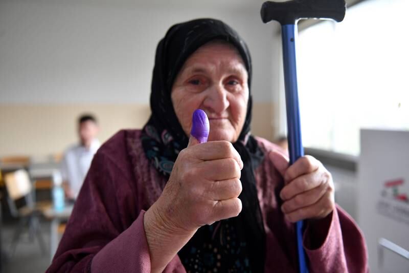 A Lebanese woman shows her ink-marked thumb after voting in Shmustar, Bekaa valley. EPA