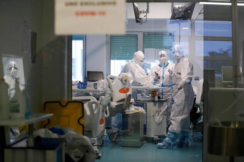 Medical personnel work inside a Covid-19 Intensive Care Unit at the Military Hospital in Lisbon, Portugal. At the hospital, hundreds of troops have spent frantic weeks this month rushing to turn every available space into makeshift Covid-19 wards. AP Photo