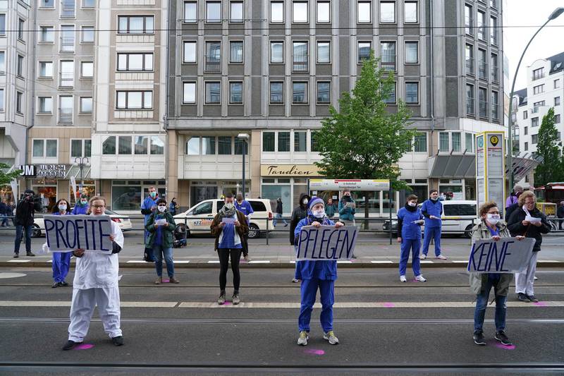 Even protesting has changed as health care workers in Germany protest for more funding while keeping socially distant. Getty
