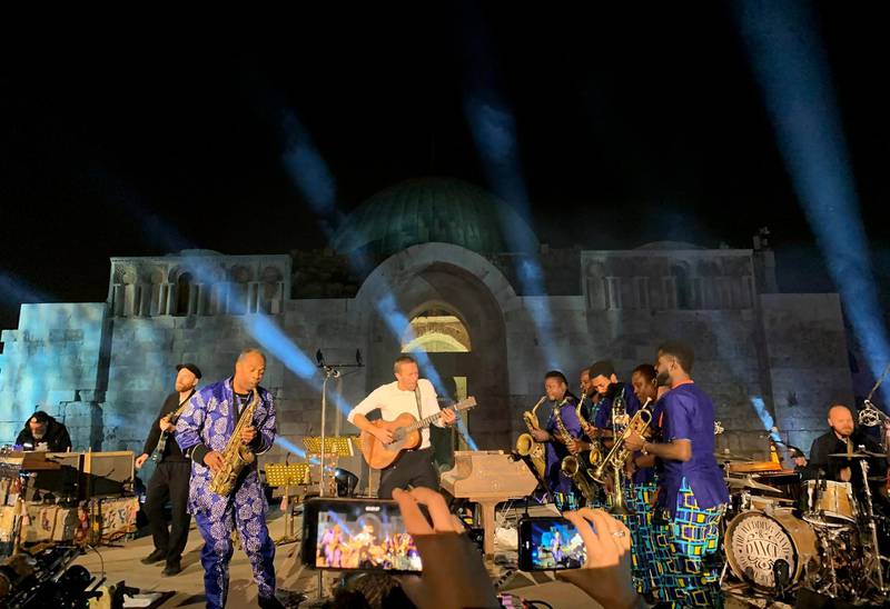 Coldplay and Kuti perform during a concert at the Citadel.