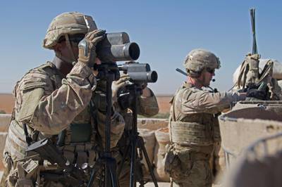 In this Nov. 1, 2018, photo released by the U.S. Army, soldiers surveil the area during a combined joint patrol in Manbij, Syria. The United Statesâ€™ main ally in Syria on Thursday, Dec. 20, 2018, rejected President Donald Trumpâ€™s claim that Islamic State militants have been defeated and warned that the withdrawal of American troops would lead to a resurgence of the extremist group. (U.S. Army photo by Spc. Zoe Garbarino via AP)