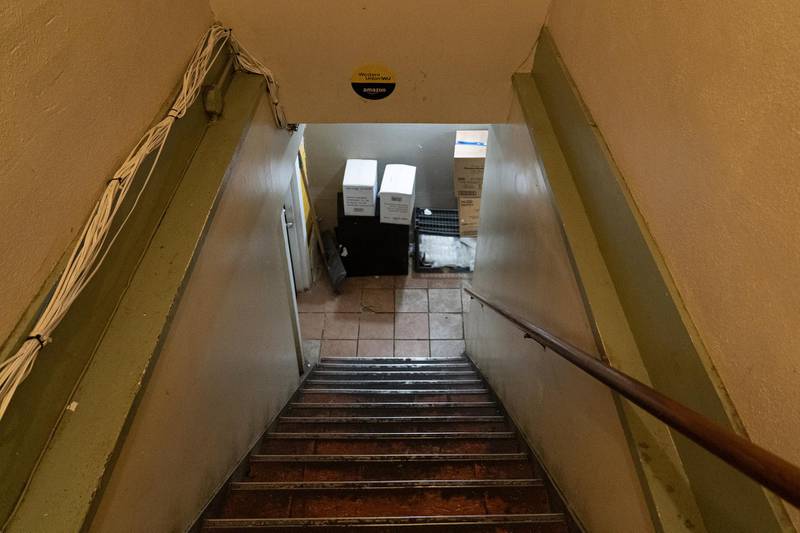The stairs that lead to the basement of Cup Foods where the mosque is located. Willy Lowry / The National 