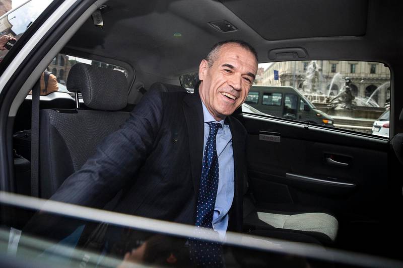 Economist Carlo Cottarelli gets in a taxi to go to the Quirinale Presidential Palace, in Rome, Monday, May 28, 2018. Italy's president Sergio Mattarella invited Cottarelli to the presidential palace on Monday amid speculation he would ask the former International Monetary Fund official to form a technical government following the collapse of what would have been Western Europe's first populist government. (Angelo Carconi/ANSA via AP)