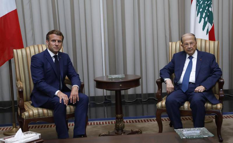 Lebanon's President Michel Aoun meets French President Emmanuel Macron on his arrival at the airport in Beirut. Dalati Nohra/Reuters