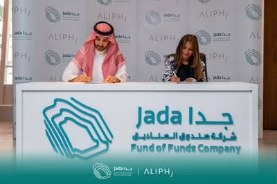 Bandr Alhomaly, left, chief executive of Jada Fund of Funds, and Huda Al Lawati, founder and chief executive of Aliph Capital, signing the agreement. Photo: Aliph Capital