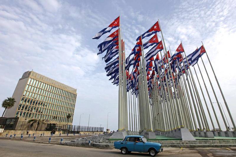 A car drives past the building of the the US diplomatic mission in Cuba. Desmond Boylan / AP Photo