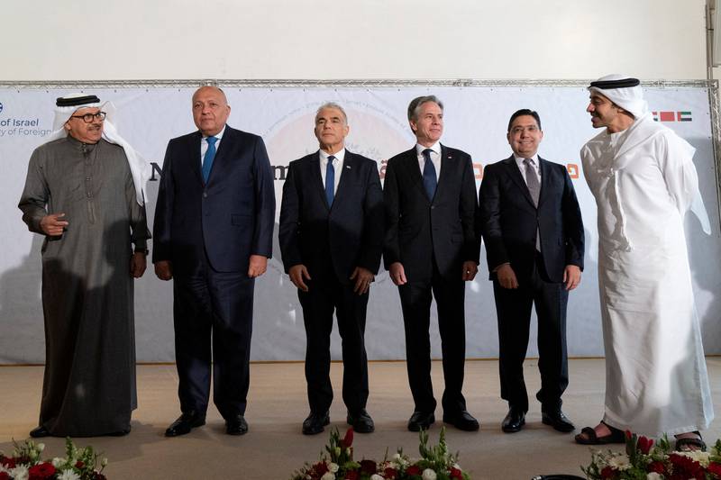 Sheikh Abdullah bin Zayed, Minister of Foreign Affairs and International Co-operation, with, from left, foreign ministers Abdullatif bin Rashid Al Zayani, of Bahrain, Sameh Shoukry of Egypt and Yair Lapid, of Israel, US Secretary of State Antony Blinken and Morocco's Foreign Minister Nasser Bourita at the Negev summit in Sde Boker, Israel. Reuters
