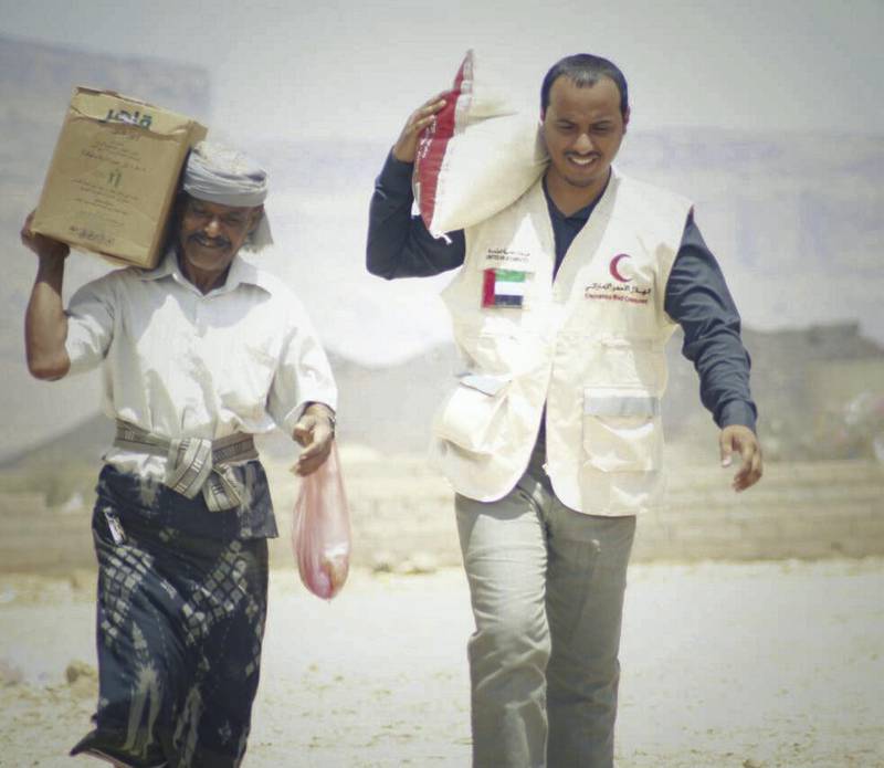 The Emirates Red Crescent distributes emergency food aid. Wam