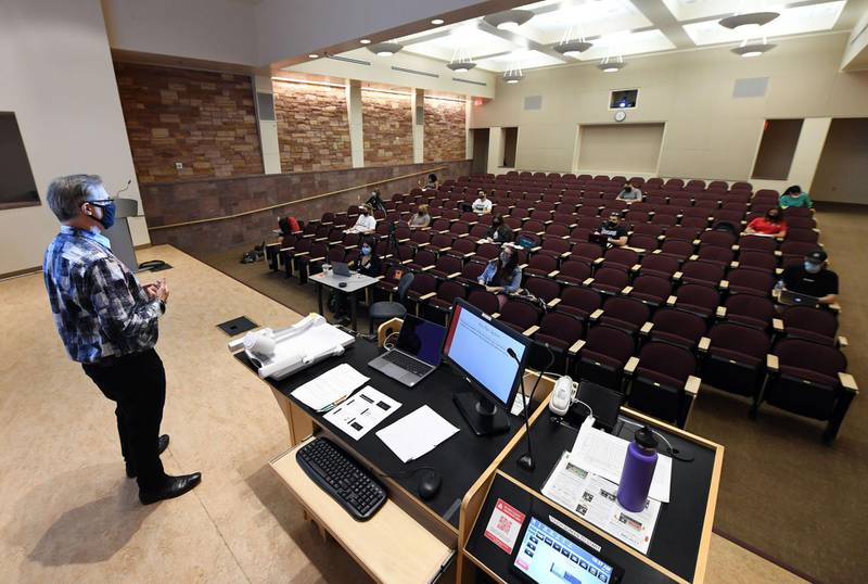 LAS VEGAS, NEVADA - SEPTEMBER 09: UNLV Department of Criminal Justice chairman and professor Dr. Joel Lieberman teaches Jury Decision Making, a criminal justice class at UNLV, amid the spread of the coronavirus (COVID-19) on September 9, 2020 in Las Vegas, Nevada. Although it is an in-person class, Lieberman allowed the students to choose how they would attend, in person or online, with the choice almost evenly split between the two. To lower the number of people on campus to allow for social distancing because of the pandemic, the university moved fall 2020 courses with more than 50 students, about 80 percent of its classes, to remote instruction, with 20 percent of courses held in-person or hybrid. UNLV is only using large classrooms with spaced out seating and under 50 percent capacity for in-person classes, which are now staggered to reduce density on the campus.   Ethan Miller/Getty Images/AFP
== FOR NEWSPAPERS, INTERNET, TELCOS & TELEVISION USE ONLY ==
