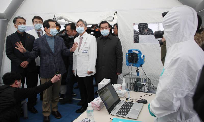 South Korea Prime Minister Chung Sye-kyun (3-L) visits a hospital, to see the hospital's quarantine efforts to prevent the spread of Wuhan coronavirus, in Seoul, South Korea.  EPA