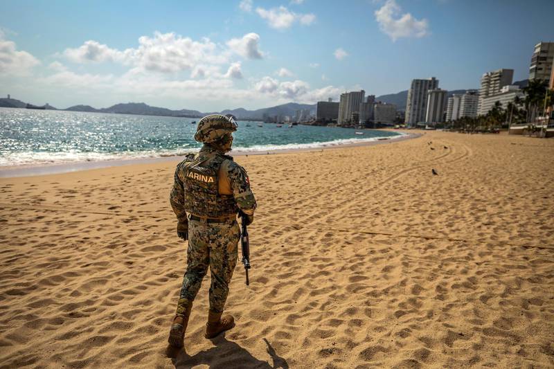 Members of the military personnel patrol a hotel area and the beaches in Acapulco, Guerrero, Mexico.  EPA