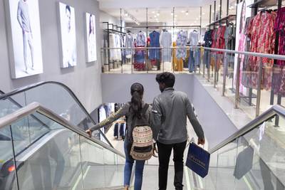 Customers descend a staircase at a Westside store operated by Trent Ltd., the retail unit of Tata Group, in Mumbai, India, on Wednesday, June 20, 2019. For nearly a decade, Tata has been Inditex SA's partner running Zara stores in India. Now, the country's largest conglomerate is building its own apparel empire as trend-focused as Zara -- but at half the price. For nearly a decade, Tata Group has been Inditex SA's partner running Zara stores in India. Now, the country's largest conglomerate is building its own apparel empire as trend-focused as Zara -- but at half the price. Photographer: Kanishka Sonthalia/Bloomberg