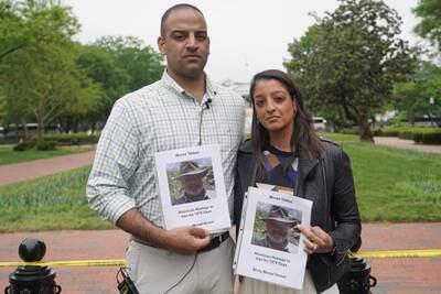 Teymoor and Tara Tahbaz hold photos of their father Morad. Willy Lowry / The National
