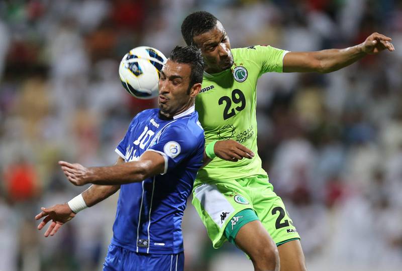  Dubai United Arab Emirates- May,15, 2013:  Al Shabab (UAE - green )  and (L)  Esteghlal (Iran - blue) in action during the AFC Championships League match at  the Al Shabab Stadium in Dubai.  ( Al Ittihad ) 


 