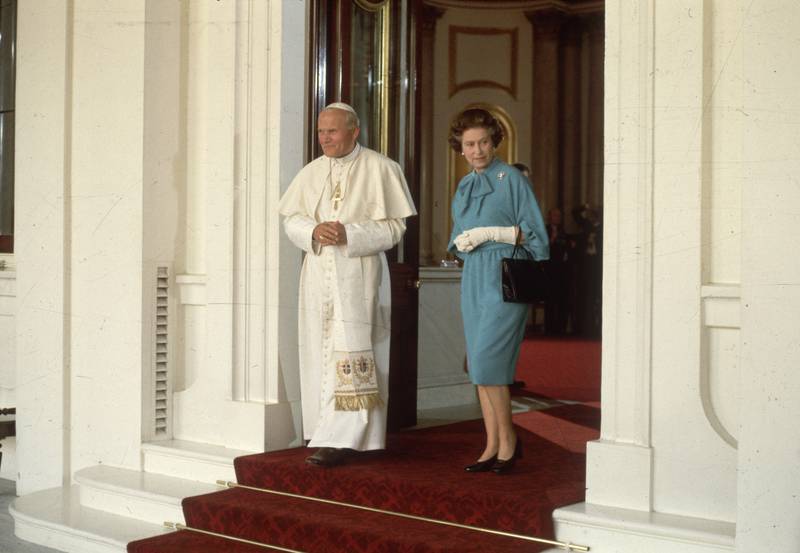 The late Pope John Paul II with Queen Elizabeth at Buckingham Palace in May 1982. Getty Images