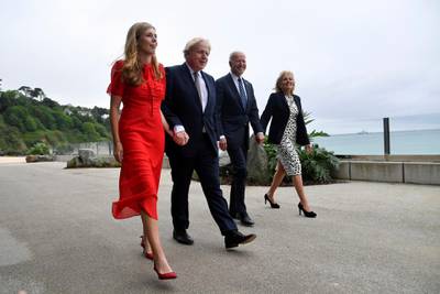 Britain's Prime Minister Boris Johnson, his wife Carrie Johnson and U.S. President Joe Biden with first lady Jill Biden walk outside Carbis Bay Hotel, Carbis Bay, Cornwall, Britain, ahead of the G7 summit, Thursday June 10, 2021. (Toby Melville/Pool Photo via AP)