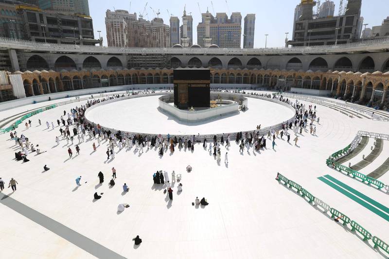 Muslim worshippers circumambulate the sacred Kaaba in Mecca's Grand Mosque, Islam's holiest site. Saudi Arabia reopened today the area around the sacred Kaaba, reversing one of a series of measures introduced to combat the coronavirus outbreak.  AFP