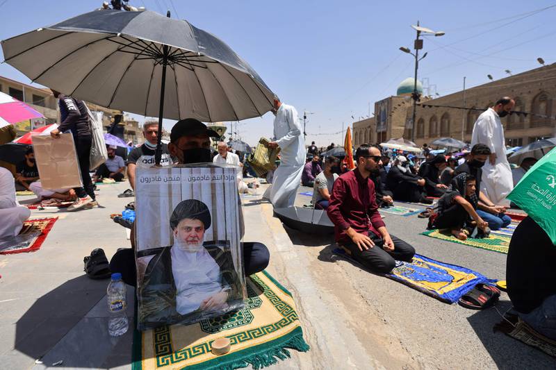 Supporters of Iraqi Shiite cleric Moqtada Al Sadr attend Friday prayers in Sadr City, east of Baghdad. AFP
