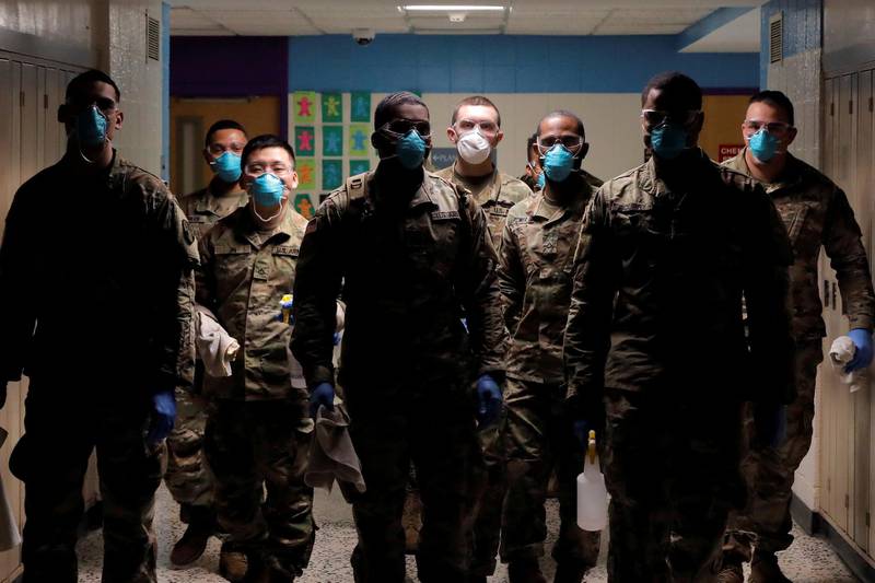 Members of Joint Task Force 2, composed of soldiers and airmen from the New York Army and Air National Guard, work to sanitize the New Rochelle High School during the coronavirus disease (COVID-19) outbreak in New Rochelle, New York, U.S. REUTERS