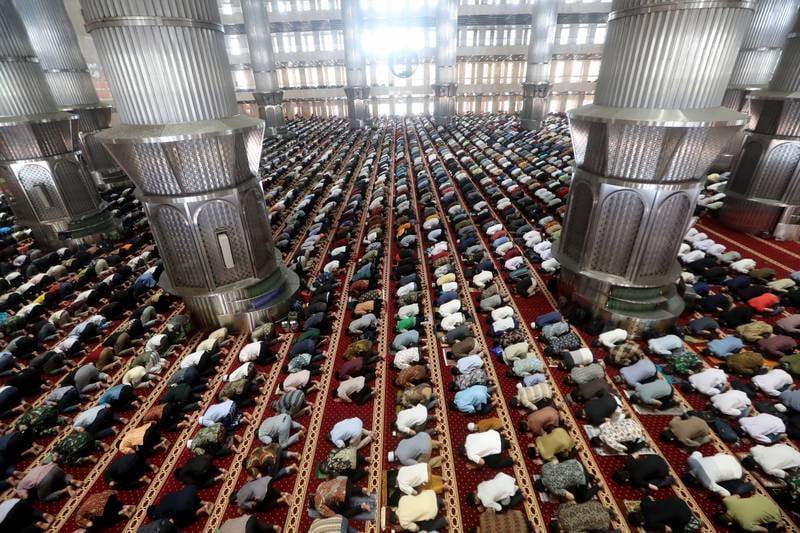 Men attend the first Friday prayers of Ramadan at the Istiqlal Mosque in Jakarta, Indonesia. EPA