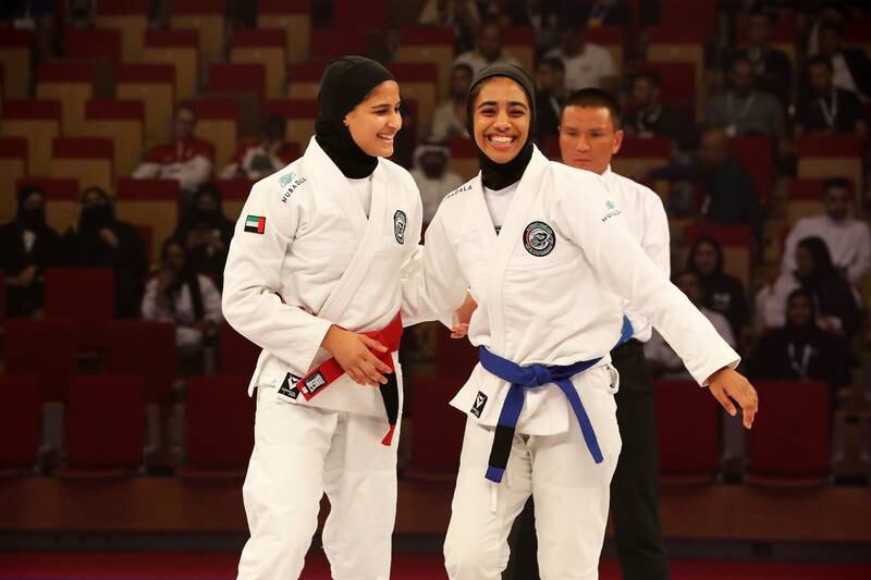 UAE's Asma Al Hosani (red) beat compatriot Shamsa Al Ameri (blue) in the female 52kg final during the JJIF World Youth Championship at the Jiu-Jitsu Arena in Abu Dhabi. Pawan Singh / The National