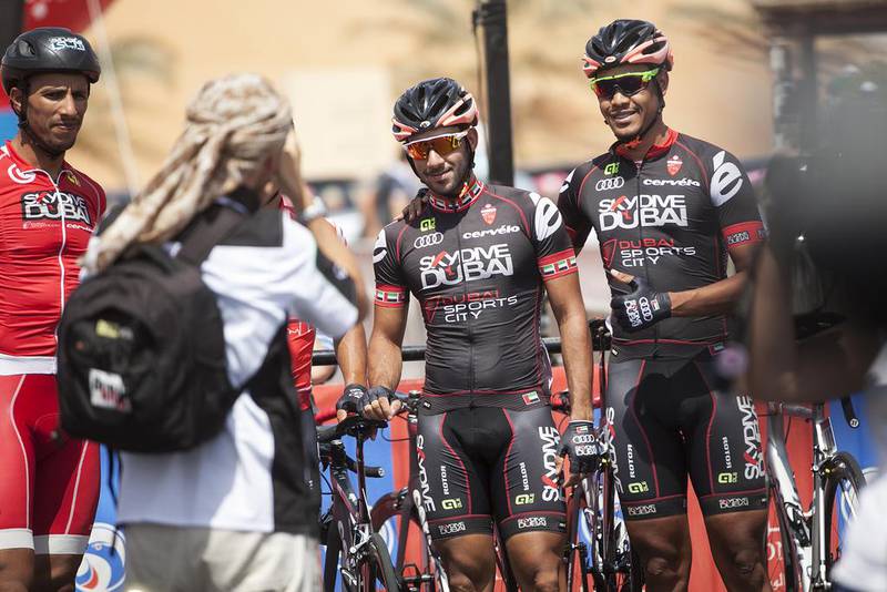 Skydive Dubai team riders pose for a photo on Thursday on the first day of the Abu Dhabi Tour. Mona Al Marzooqi / The National
