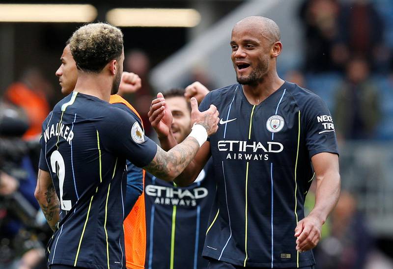 Manchester City's Kyle Walker and Vincent Kompany celebrate after the match. Reuters