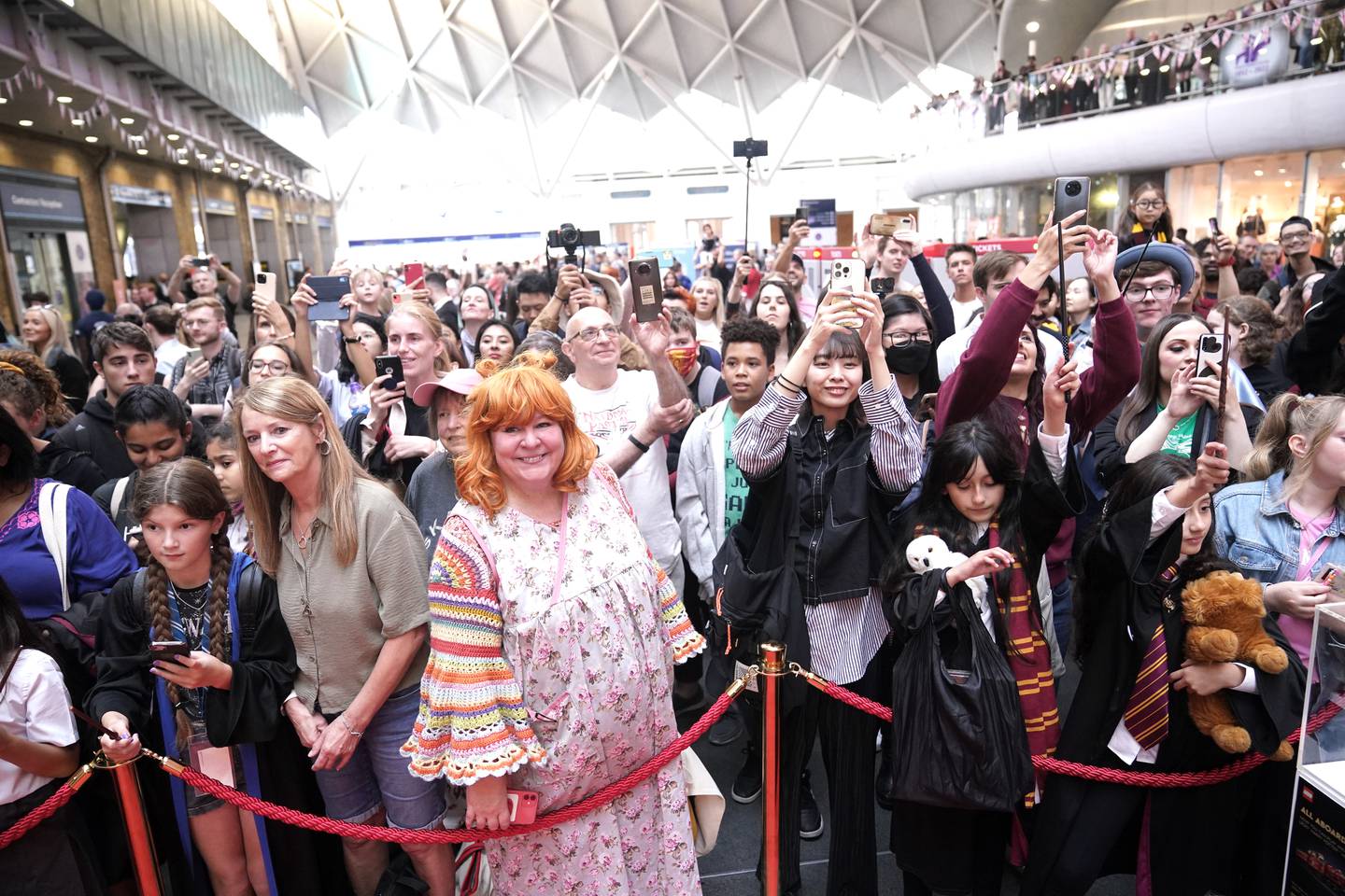 Fans, young and old, visited London King's Cross station as part of celebrations marking the 25th anniversary of first book. PA