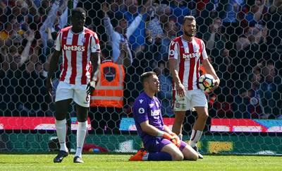 Stoke City goalkeeper Jack Butland, centre, reacts after Crystal Palace's Patrick van Aanholt scores his side's second goal of the game, during the English Premier League soccer match between Stoke City and Crystal Palace, at the bet365 Stadium, in Stoke, England, Saturday May 5, 2018. (Dave Thompson/PA via AP)